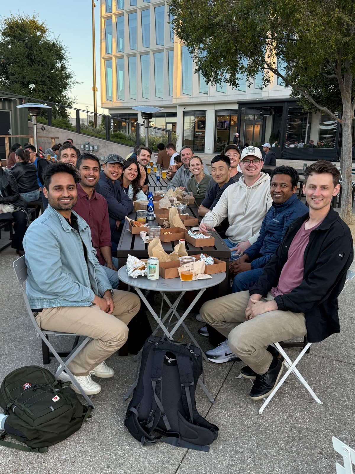The Convey team gathered around a table outdoors